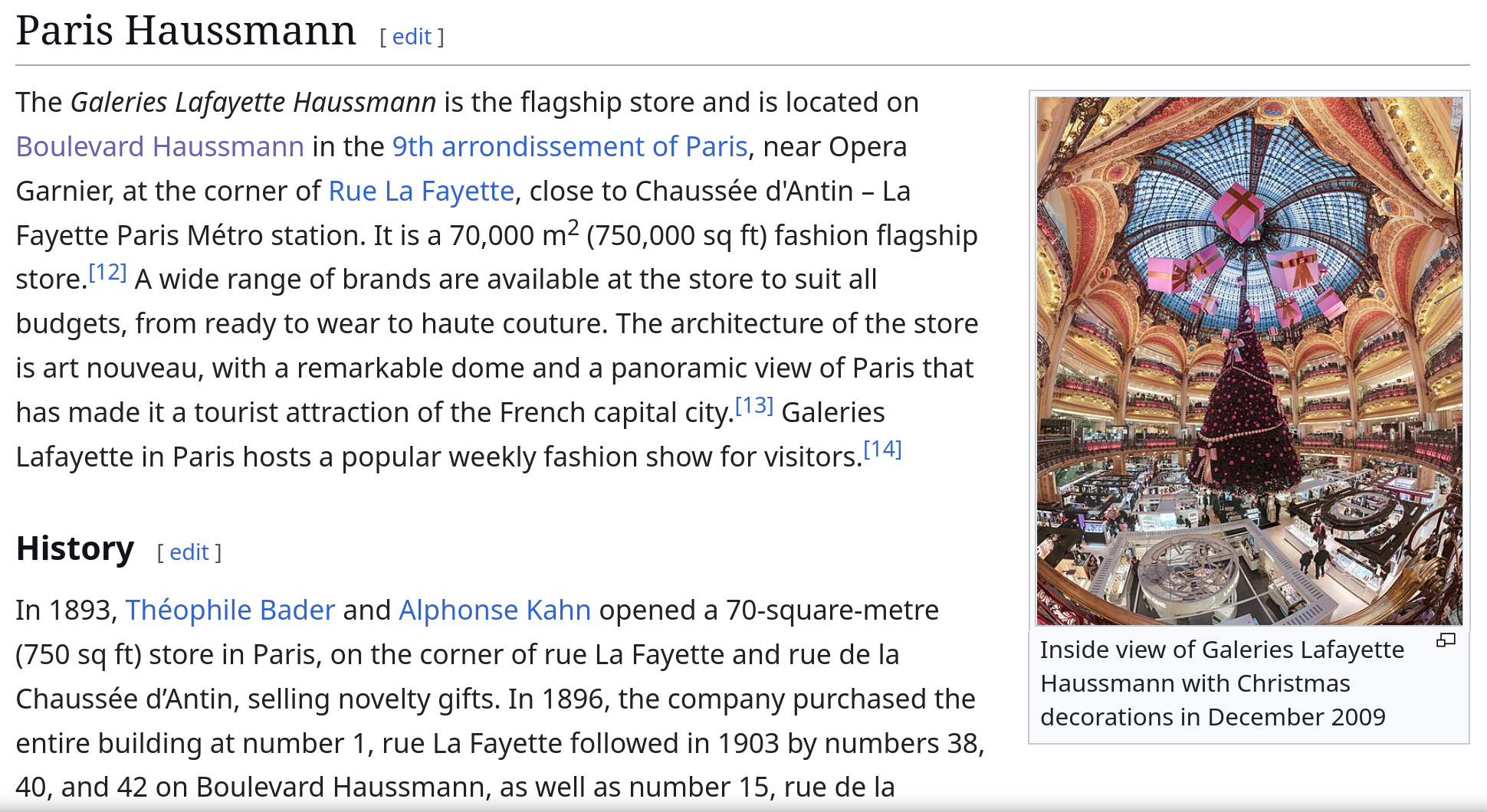  Dome and balconies of Galeries Lafayette store, lady section, in boulevard Haussmann, Paris, with Christmas decorations. This picture has a 170° field of view.