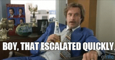 A guy in a blue suit sat at a desk drinking a beer. Text underneath says ‘Boy, that escalated quickly’